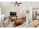 Inviting living room featuring hardwood floors, a ceiling fan, and comfortable seating at 1155 Moores Mill Nw Rd, Atlanta, GA 30327