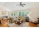 Cozy living room with hardwood floors, bright windows, and comfortable seating arrangement at 1155 Moores Mill Nw Rd, Atlanta, GA 30327