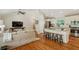 Open-concept living space seamlessly connects the living room and kitchen with hardwood flooring at 1155 Moores Mill Nw Rd, Atlanta, GA 30327