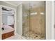 Tiled walk-in shower with glass door, showcasing luxury and design at 1155 Moores Mill Nw Rd, Atlanta, GA 30327