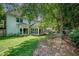 A well-maintained backyard with manicured lawn and a patio area perfect for outdoor relaxation at 1187 Druid Walk, Decatur, GA 30033