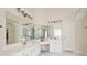 Bright bathroom with double sinks, a makeup vanity, and white tile floors at 1187 Druid Walk, Decatur, GA 30033