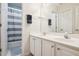 A well-lit bathroom with dual vanities, a large mirror, and a shower/tub combo at 1187 Druid Walk, Decatur, GA 30033