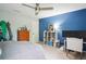 Comfortable bedroom featuring a ceiling fan, a large window, and a well-lit work space at 1187 Druid Walk, Decatur, GA 30033