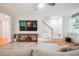 Comfortable living room with hardwood floors, a ceiling fan, and a large television on the wall at 1187 Druid Walk, Decatur, GA 30033