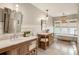 Beautiful bathroom with dual vanities, a soaking tub, and a glass-enclosed shower at 230 Pebble Trl, Alpharetta, GA 30009
