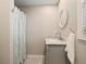 Well-lit bathroom featuring a marble countertop and subway tile shower at 230 Pebble Trl, Alpharetta, GA 30009