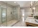 Elegant bathroom with marble countertops, a walk-in shower, and dual vanities at 230 Pebble Trl, Alpharetta, GA 30009