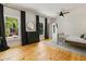 Bright bedroom boasts hardwood floors, two windows with view and a modern ceiling fan and polka dot curtains at 230 Pebble Trl, Alpharetta, GA 30009