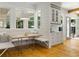 Cozy breakfast nook with built-in seating, large windows, and decorative lighting at 230 Pebble Trl, Alpharetta, GA 30009