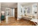 Charming dining area with a built-in bench, rustic sliding barn door, and natural light from the windows at 230 Pebble Trl, Alpharetta, GA 30009