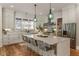 Spacious kitchen with large island, pendant lighting, and stainless steel appliances at 230 Pebble Trl, Alpharetta, GA 30009