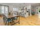 Open concept kitchen with white cabinetry, stainless appliances, and eat-in island at 230 Pebble Trl, Alpharetta, GA 30009