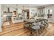 Spacious open-concept kitchen and dining area featuring a large island and hardwood flooring throughout at 230 Pebble Trl, Alpharetta, GA 30009