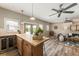 Charming kitchenette island with an under-counter refrigerator, overlooking a well-appointed living room at 230 Pebble Trl, Alpharetta, GA 30009
