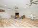 Large living area featuring sleek flooring and comfortable seating arrangement at 230 Pebble Trl, Alpharetta, GA 30009