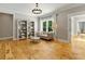 Living room with hardwood floors, stylish bookcase, and a comfortable seating area at 230 Pebble Trl, Alpharetta, GA 30009