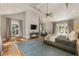 Bright main bedroom with a vaulted ceiling, hardwood floors, and large windows at 230 Pebble Trl, Alpharetta, GA 30009