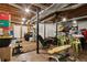 This basement includes space for working out with included weightlifting equipment at 5155 Pine Branch Pt, Atlanta, GA 30338