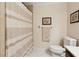 Neutral bathroom with a shower/tub, white tile flooring, neutral walls, and a wood vanity at 5155 Pine Branch Pt, Atlanta, GA 30338