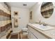 This bathroom features a large mirror and a shower with a decorative striped curtain at 5155 Pine Branch Pt, Atlanta, GA 30338