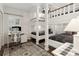Bright bedroom featuring bunk beds and a dedicated workspace at 5155 Pine Branch Pt, Atlanta, GA 30338