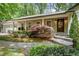 Inviting home exterior with stone steps and manicured landscaping at 5155 Pine Branch Pt, Atlanta, GA 30338