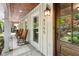 Welcoming front porch with rocking chairs and stone flooring at 5155 Pine Branch Pt, Atlanta, GA 30338