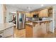 Traditional kitchen featuring stainless steel appliances, granite counters, and light wood cabinets at 5155 Pine Branch Pt, Atlanta, GA 30338
