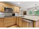 Kitchen featuring granite countertops, a stainless steel dishwasher and lots of counterspace at 5155 Pine Branch Pt, Atlanta, GA 30338