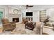 Cozy living room with brick fireplace and built-in bookshelves at 5155 Pine Branch Pt, Atlanta, GA 30338