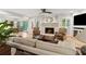 Cozy living room with fireplace and large windows at 5155 Pine Branch Pt, Atlanta, GA 30338