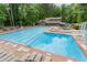 Large swimming pool with diving board and lots of space for relaxing and swimming laps at 5155 Pine Branch Pt, Atlanta, GA 30338