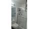 Modern bathroom featuring a toilet, mirror, and shower, offering a clean and functional space at 6620 Wellington Sq, Norcross, GA 30093