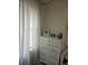Bright bedroom showcases a white dresser beside a window with light-filtering curtains at 6620 Wellington Sq, Norcross, GA 30093