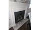 Close-up of a fireplace with a white mantle and tiled hearth, adding warmth to the home at 6620 Wellington Sq, Norcross, GA 30093