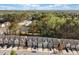 Neighborhood aerial view of homes, roads, and nearby wooded area at 3016 Creekside Overlook Way, Austell, GA 30168