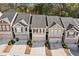 Expansive view of townhomes showing rooflines and parking at 3016 Creekside Overlook Way, Austell, GA 30168