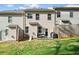 Townhome backyard featuring a grassy area and patio perfect for outdoor enjoyment and entertaining at 3016 Creekside Overlook Way, Austell, GA 30168
