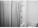 Bathroom with a shower-tub combination featuring a white shower curtain at 3016 Creekside Overlook Way, Austell, GA 30168