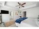 Primary bedroom featuring a ceiling fan, ensuite bathroom and an adjacent office at 3016 Creekside Overlook Way, Austell, GA 30168
