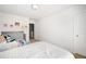 Bright bedroom with a white comforter, decor and a closet at 3016 Creekside Overlook Way, Austell, GA 30168