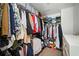 Walk-in closet filled with clothes, shoes and storage containers at 3016 Creekside Overlook Way, Austell, GA 30168