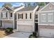 Charming townhome featuring a two-car garage and classic shutters at 3016 Creekside Overlook Way, Austell, GA 30168