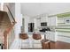 The white cabinets and stainless appliances complement the granite counter, and the green stripes give character at 3016 Creekside Overlook Way, Austell, GA 30168