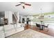Spacious living room with a dining area and staircase at 3016 Creekside Overlook Way, Austell, GA 30168