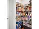 Walk-in pantry featuring wire shelving, stocked with an array of groceries and household items at 3016 Creekside Overlook Way, Austell, GA 30168