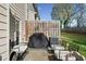Cozy outdoor patio with furniture, barbecue grill, and privacy fence for relaxing and entertaining at 3016 Creekside Overlook Way, Austell, GA 30168