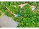 Aerial view showcasing a private home with a lake, dock, surrounded by lush greenery at 5419 Tyree Rd, Winston, GA 30187