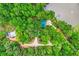 Aerial view showcasing a private home with lake, dock, surrounded by lush greenery and driveway at 5419 Tyree Rd, Winston, GA 30187